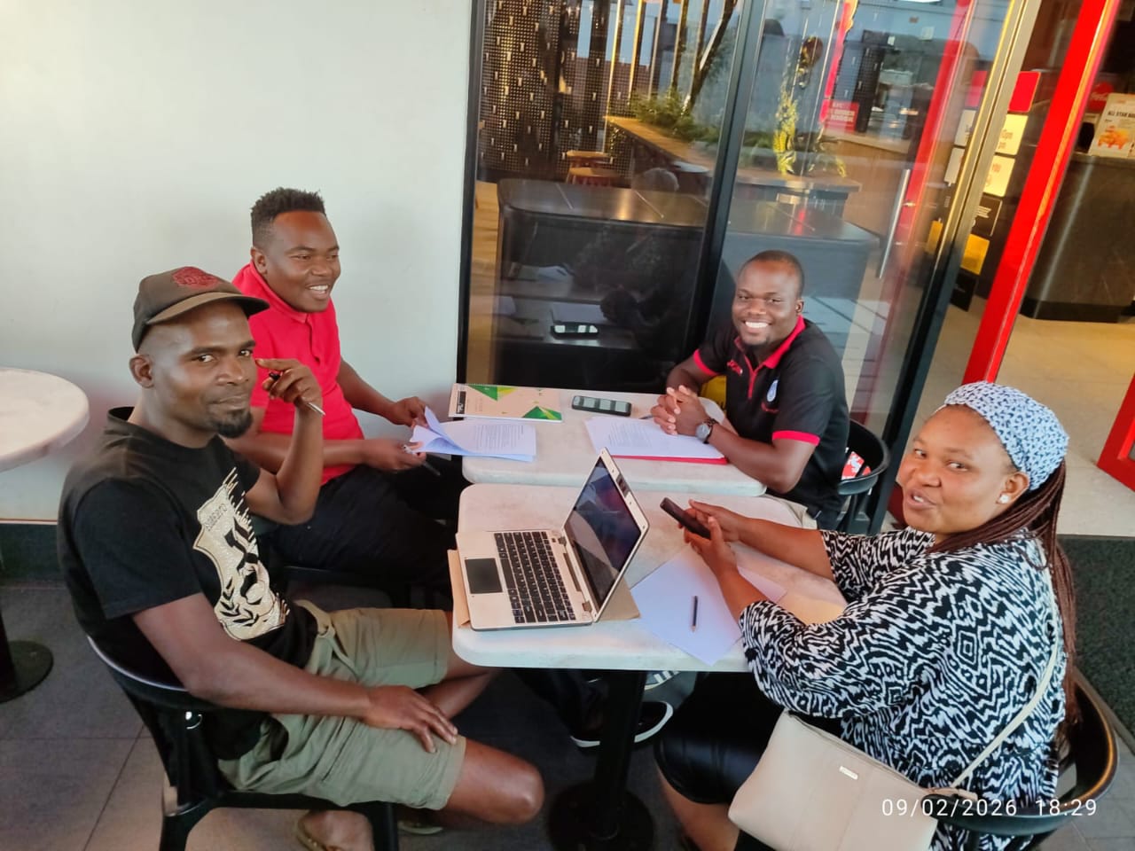 Life Goes On team members meeting together